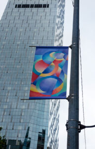 Seattle #4 Rotary, Urban Artworks and SuperGraphics partner to beautify downtown with 44 artistic banners following the shutdown. Young artists were curated by Urban Artworks for this