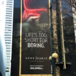 Gene Juarez Seattle Vinyl Building Banner printed and installed by Supergraphics