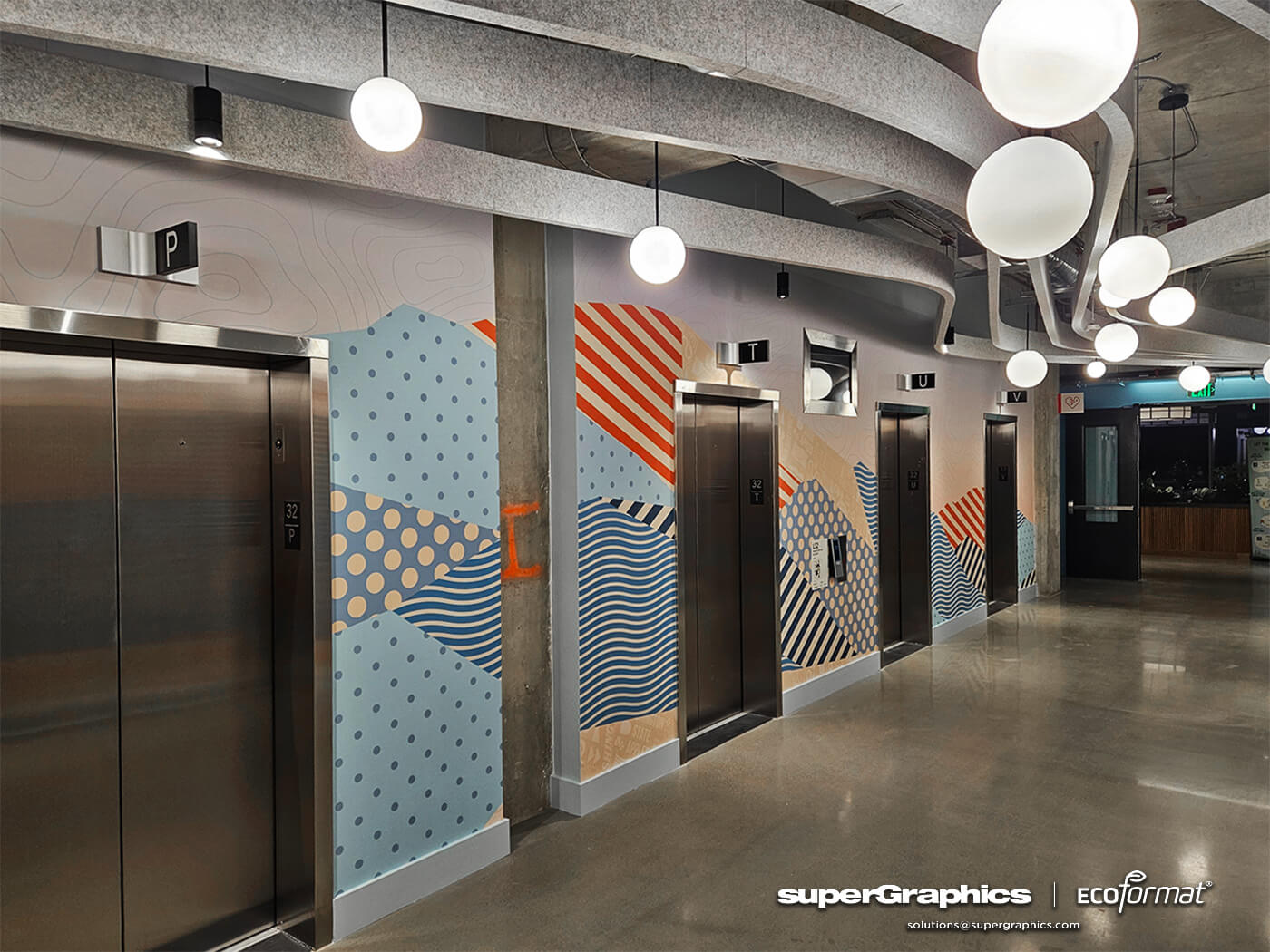 A modern office space with vibrant wall covering depicting abstract graphics, enhancing the experiential environment.