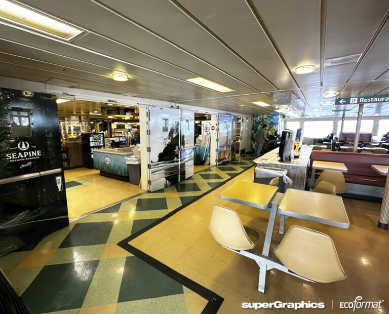 Ferry dining area with large-scale wall graphics showcasing Seapine Brewing Company branding.