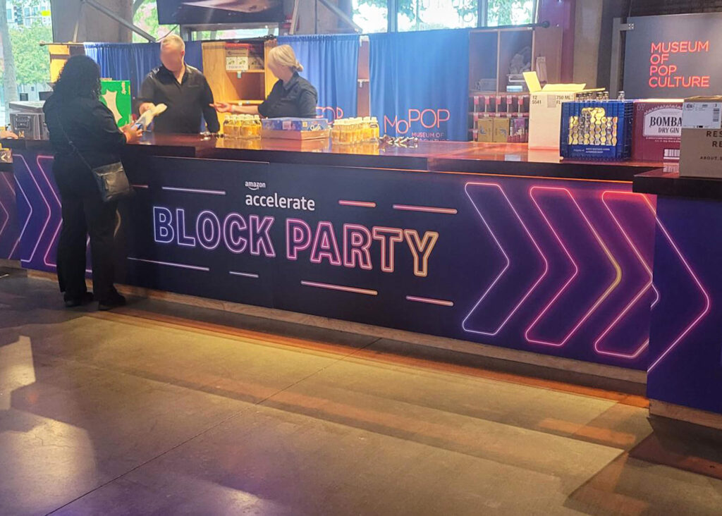 Cash Wrap from Amazon Block Party event, produced and installed by SuperGraphics. Points people to right for more event fun.
