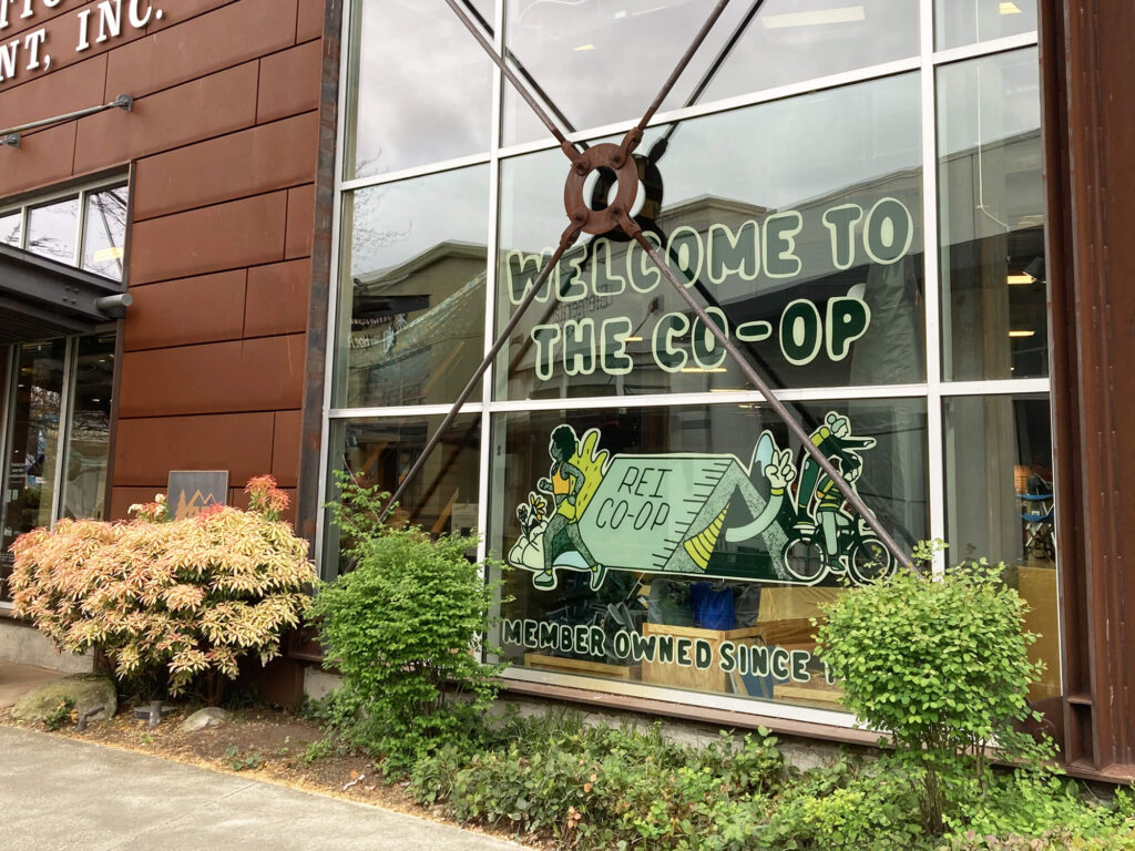 Window Graphics for REI Co-op, completed by SuperGraphics. Showcases graphic that says 'welcome to the co-op' on front of REI store.