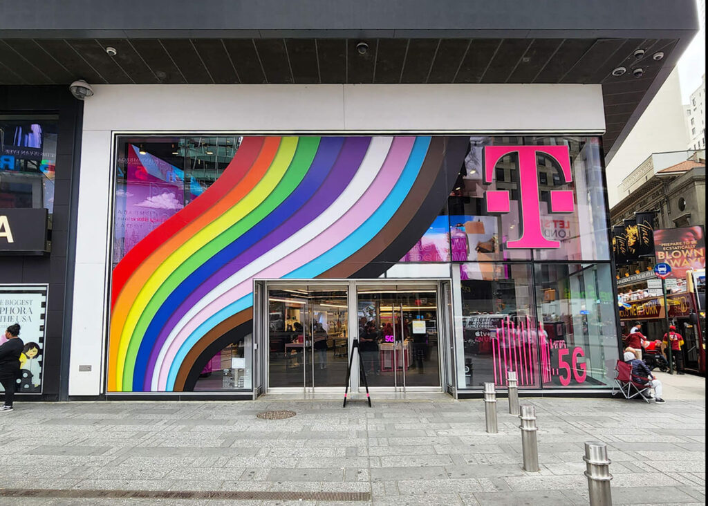 T-Mobile Pride Window Graphics, produced and installed by SuperGraphics. Showcases rainbows cascading across storefront windows.