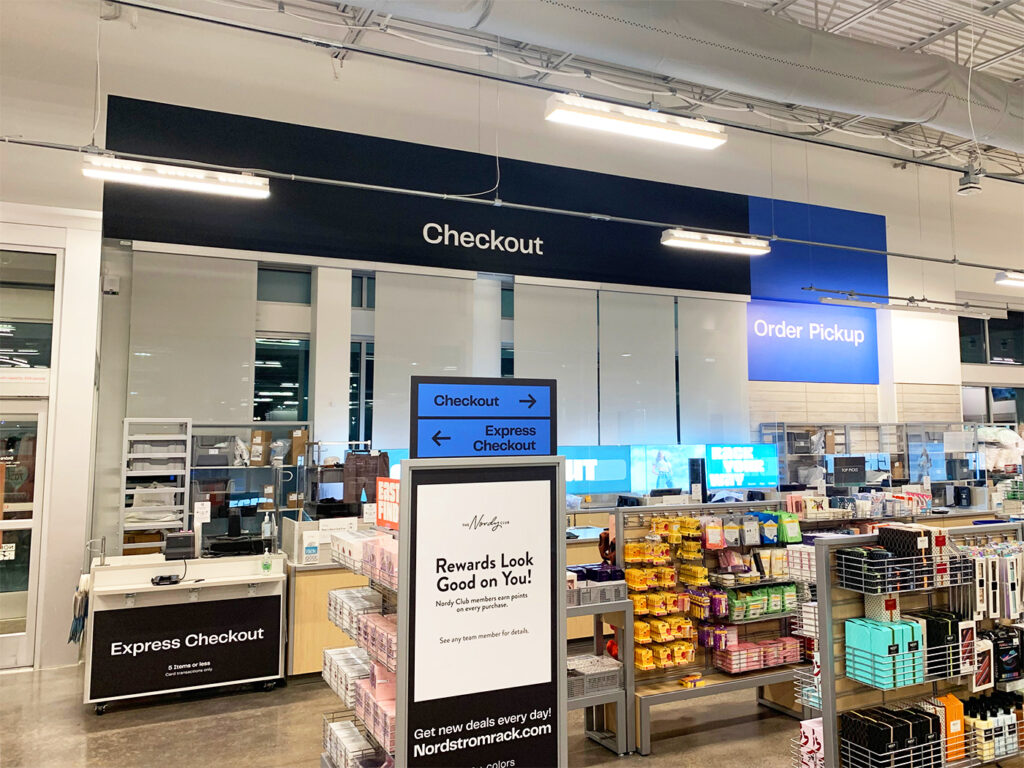 Nordstrom Rack Cash Wrap, produced and installed by SuperGraphics. Showcases signage and wall graphics for POP display.