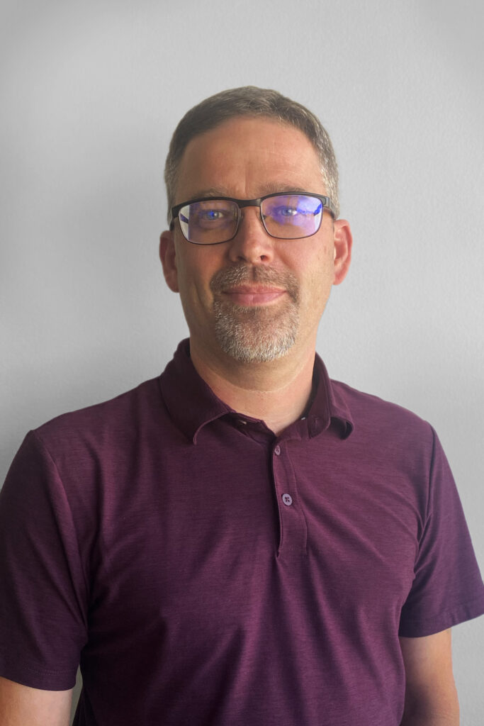 Headshot of Chris Milne, VP of Operations at SuperGraphics.