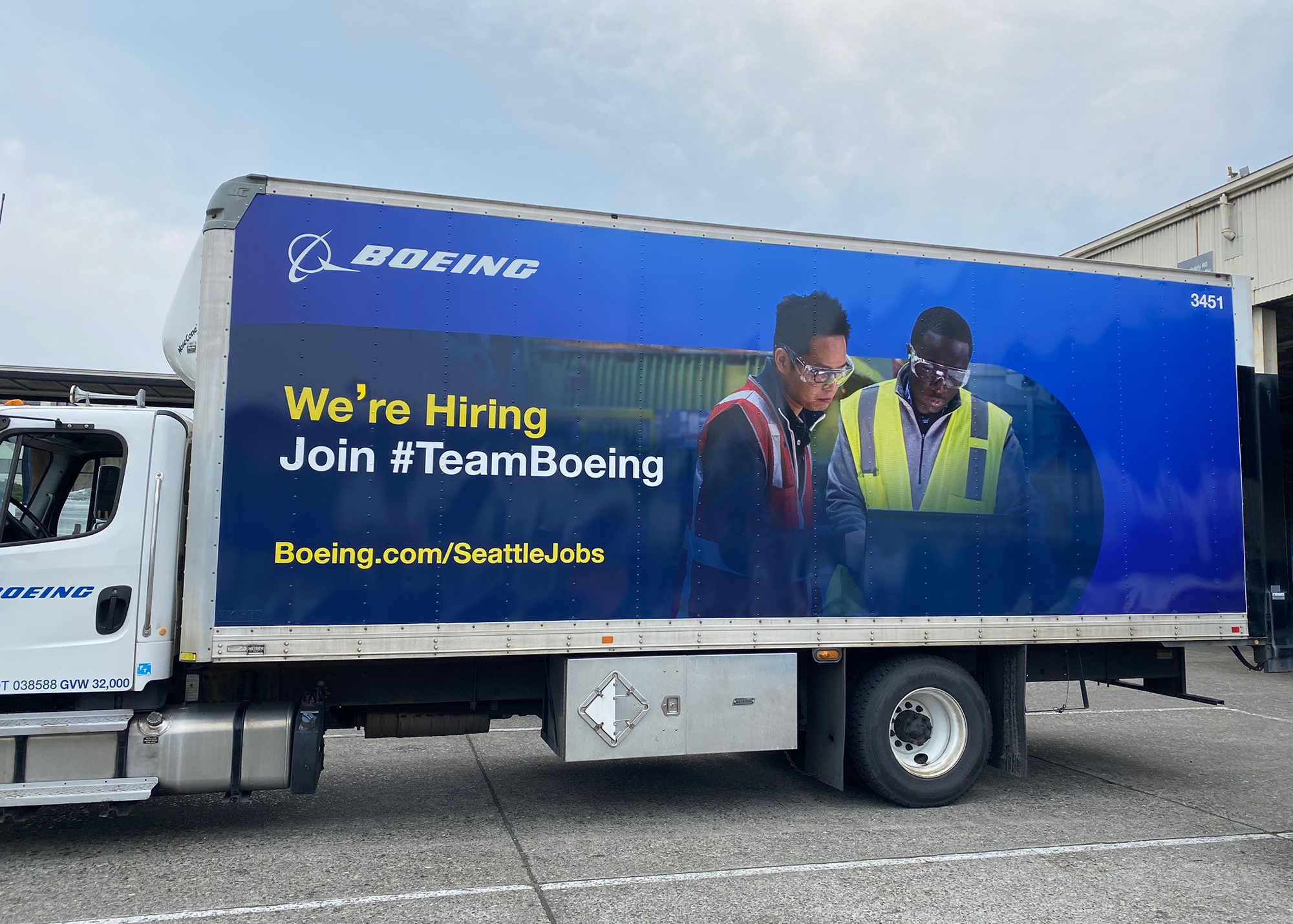 Boeing fleet truck wrap with large format recruiting graphic that reads "We're Hiring Join #TeamBoeing" on a blue background.