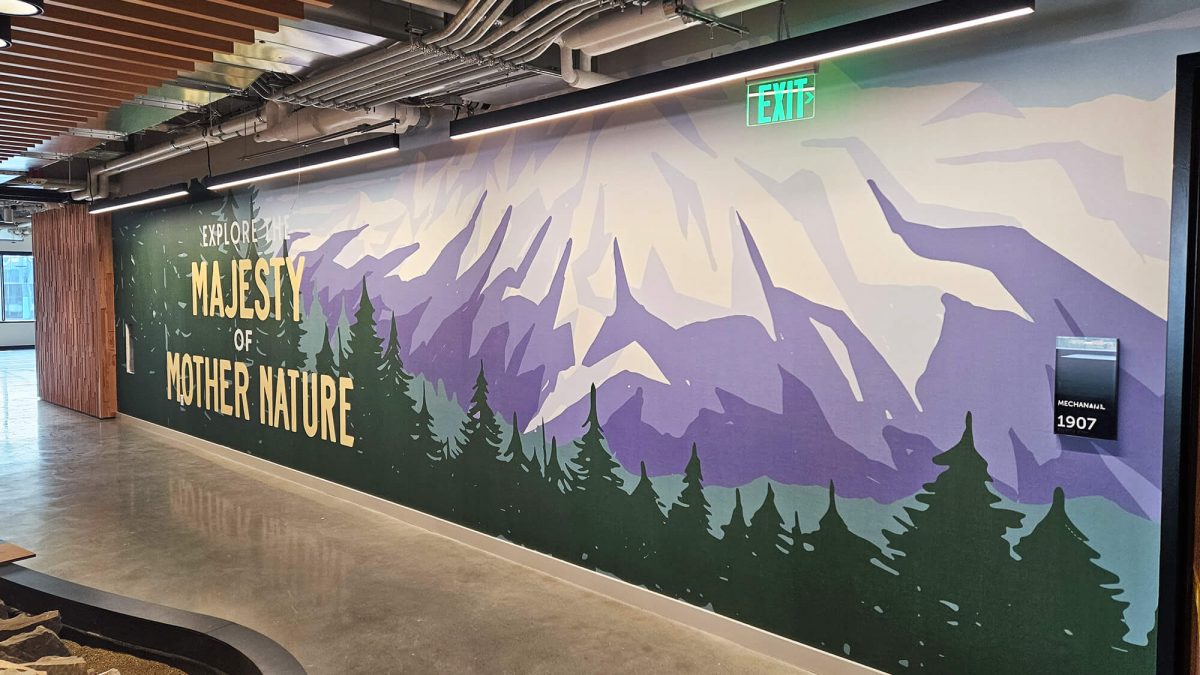 Corporate Office wall graphic produced and installed by SuperGraphics. Showcases mountain with text: Explore the Majesty of Mother Nature