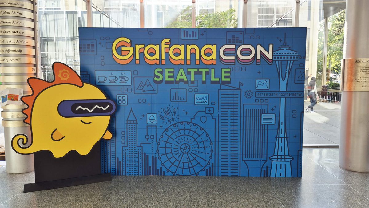 EcoFormat Display for Grafanacon tech conference, completed by SuperGraphics. Showcases skyline and yellow Grafana character in freestanding display cutouts.