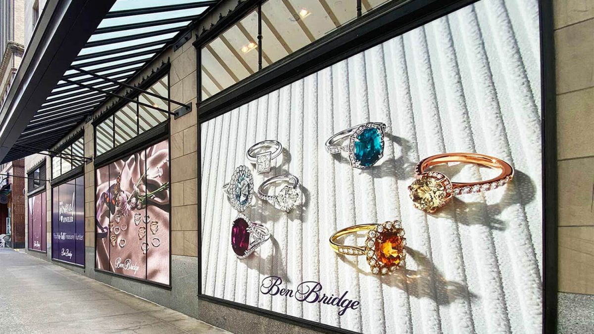 Blockout window graphics produced and installed by SuperGraphics. Showcases various Ben Bridge photography of jewelry covering storefront windows.