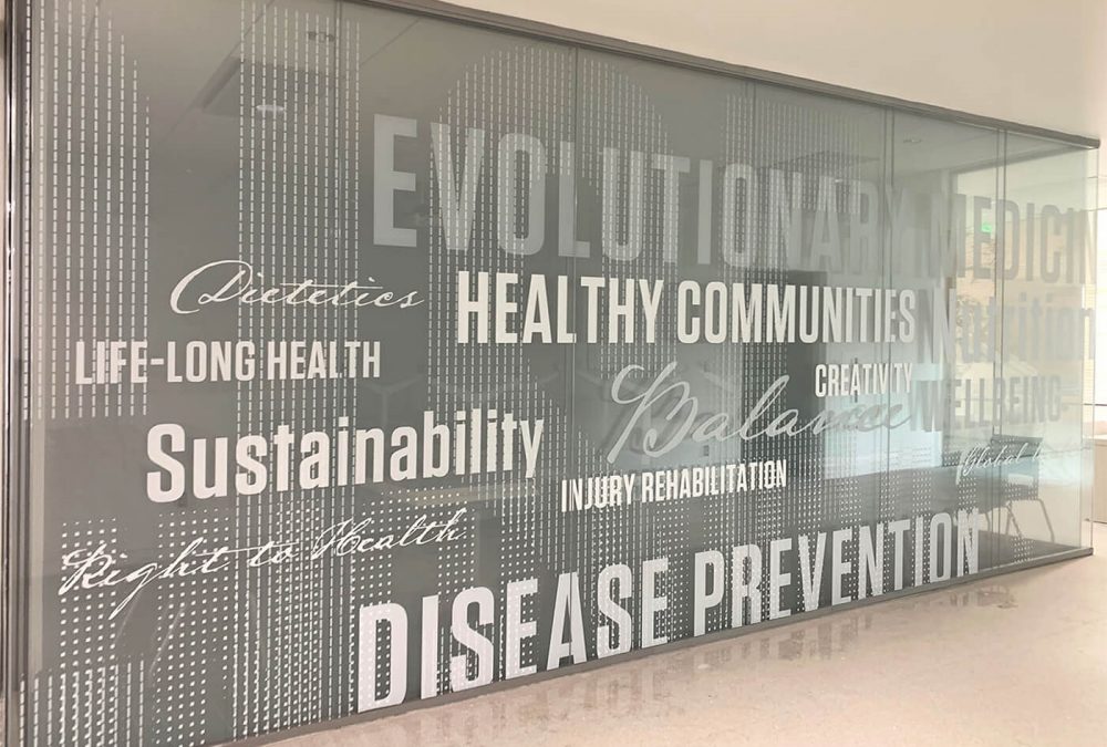 Central Washington University Health Services Window Graphics, produced and installed by SuperGraphics. Showcases health-sciences related words in various fonts on white vinyl. Serving as privacy film on glass walls.
