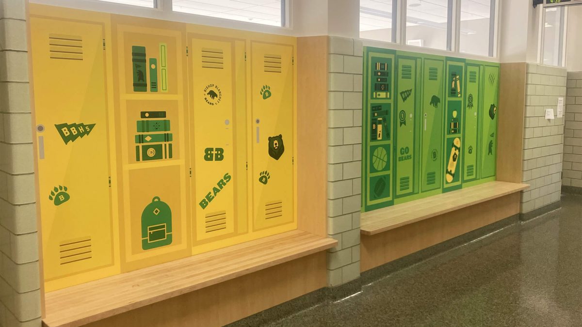 Charles Wright Academy Wall Mural, produced and installed by SuperGraphics. Showcases imagery of branded student lockers with playful iconography.