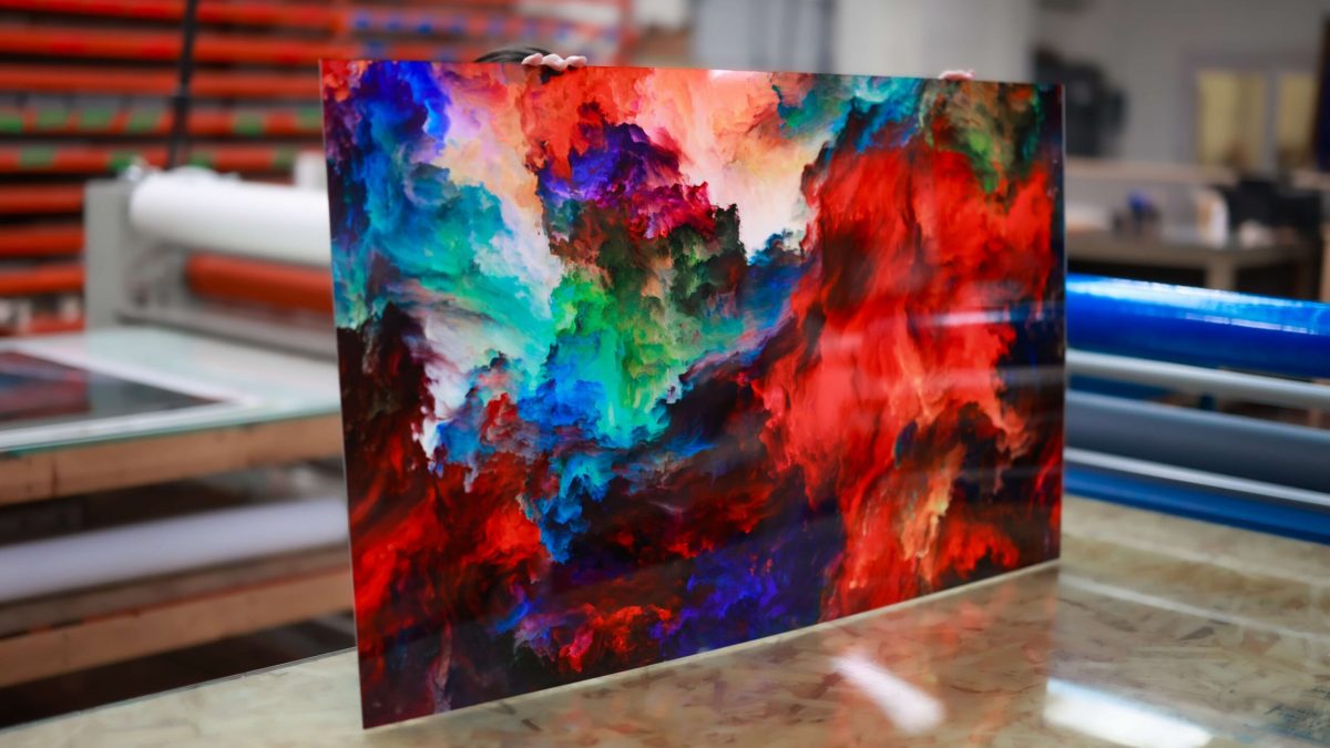 Photo of fine art print showcasing artwork of color waves. Fine art printing completed by SuperGraphics.