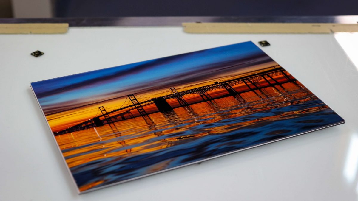 Photo of fine art print showcasing photography of bridge on the water. Fine art printing completed by SuperGraphics.