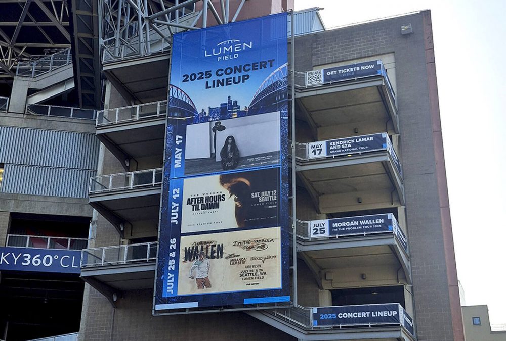 Concert banner at Lumen Field, produced and Installed by SuperGraphics. Shows upcoming artists playing in the stadium.