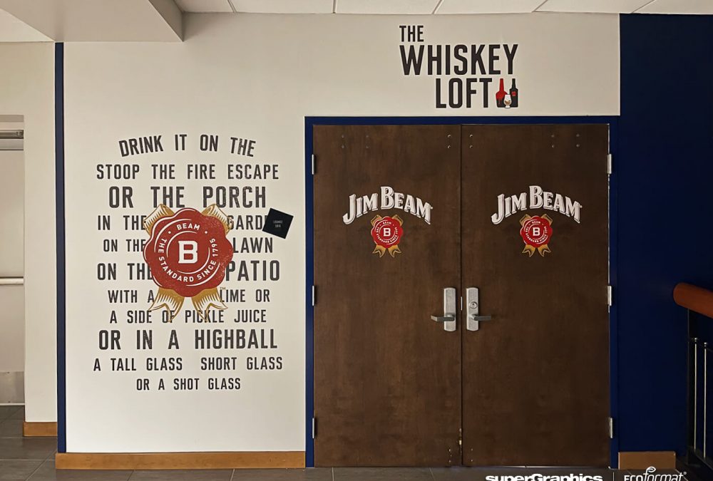 Themed wall with Jim Beam branding and slogans at Lumen Field.