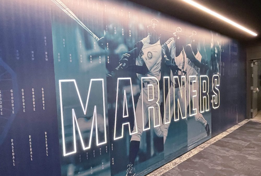 Wall mural for Seattle Mariners Training Facility, showcasing mariners branding and graphic of player. Produced and installed by SuperGraphics.