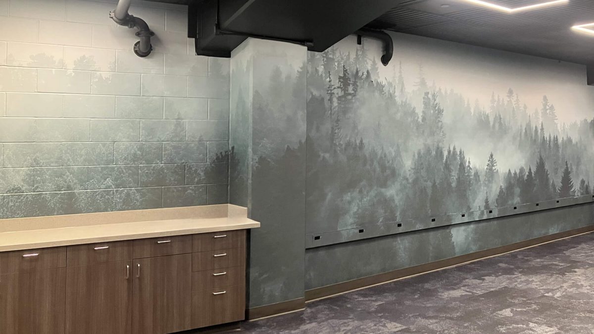 Wall mural for Seattle Mariners Training Facility, showcasing foggy mountain scene. Produced and installed by SuperGraphics.
