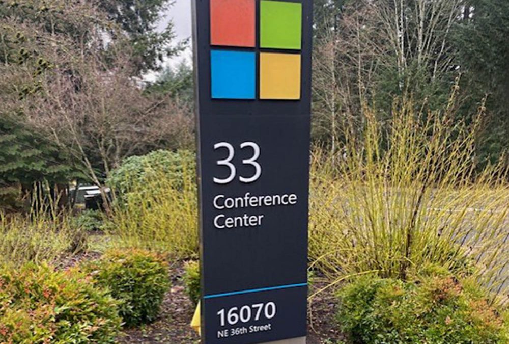 Microsoft campus monument sign displaying a four-color square logo and “33 Conference Center” with the address below.