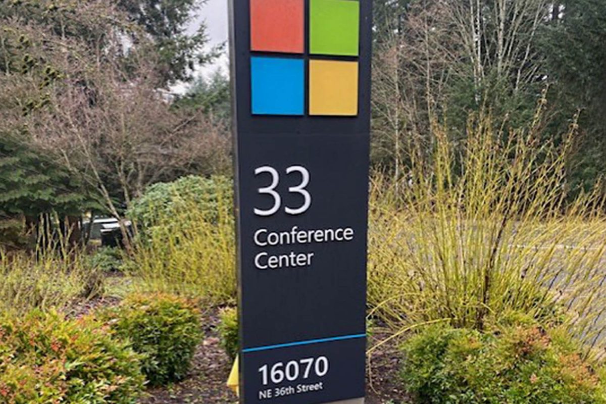 Microsoft campus monument sign displaying a four-color square logo and “33 Conference Center” with the address below.