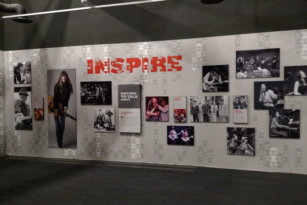 MoPOP Inspire exhibit wall featuring large-scale typography, framed photographs, and interpretive panels highlighting influential musicians, produced and installed by SuperGraphics.