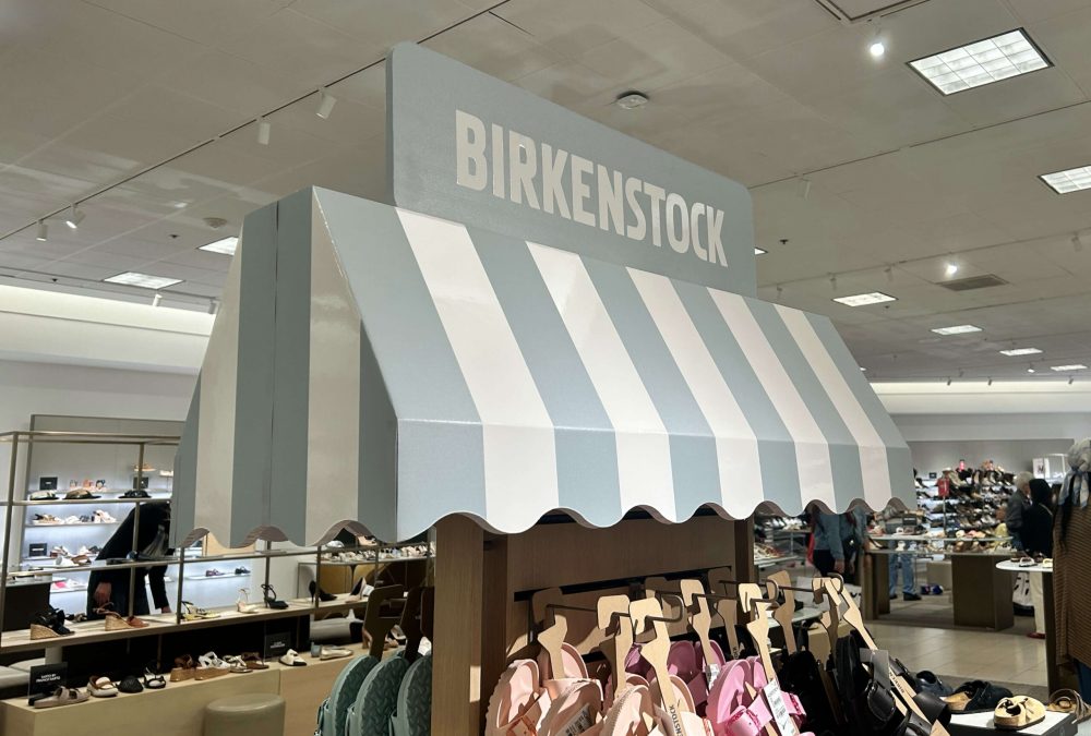 Nordstrom Display signage, produced by SuperGraphics. This EcoFormat Display was engineered from sustainable rigid board material. This display is an umbrella overhang on top of Birkenstock product display.