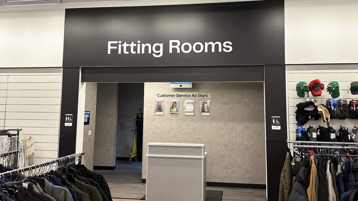 Nordstrom Rack wall mural, produced and installed by SuperGraphics. Graphic says 'Fitting Rooms' over entryway.