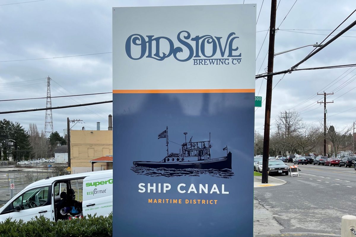 Old Stove restaurant freestanding signage, produced and installed by SuperGraphics. Features old stove branded iconography and logos on street corner.