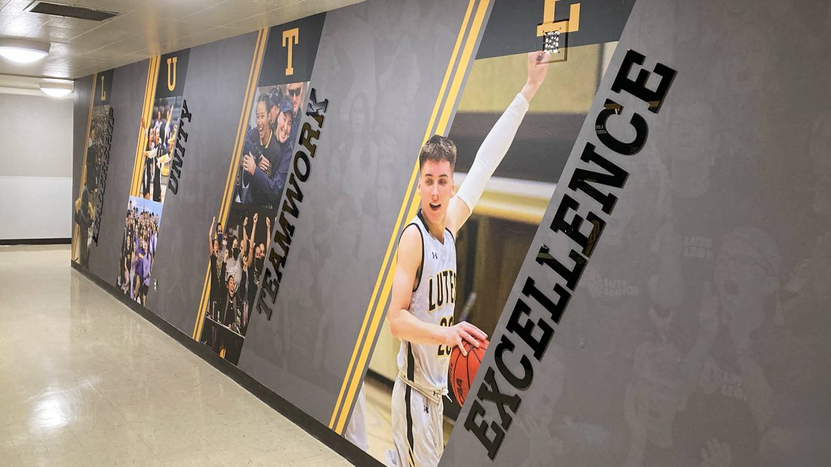 Pacific Lutheran University Athletics Wall Graphics, produced and installed by SuperGraphics. Showcases design of various student athletes along dimensional lettering of brand messaging.