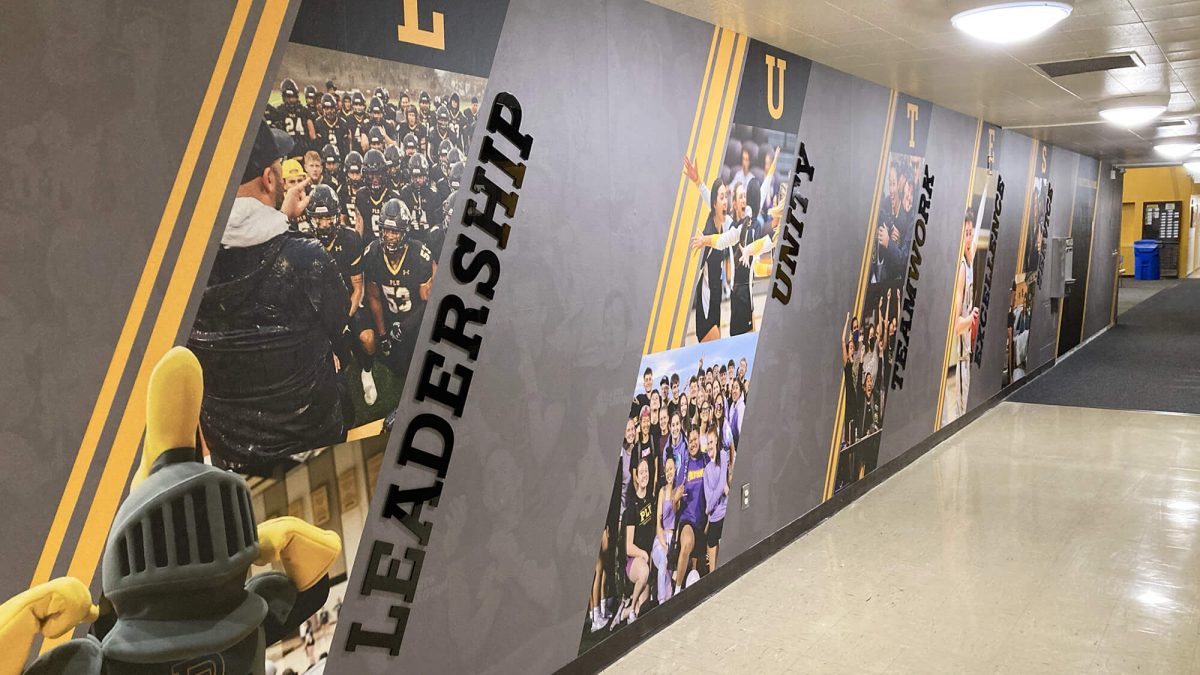 Pacific Lutheran University Athletics Wall Graphics, produced and installed by SuperGraphics. Showcases design of various student athletes along dimensional lettering of brand messaging.
