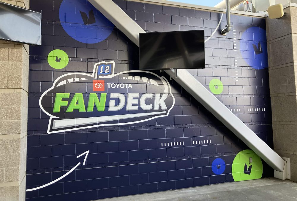 Seattle Seahawks Fan Deck Wall mural, produced and installed by SuperGraphics. States "Fan Deck" along with branding iconography.