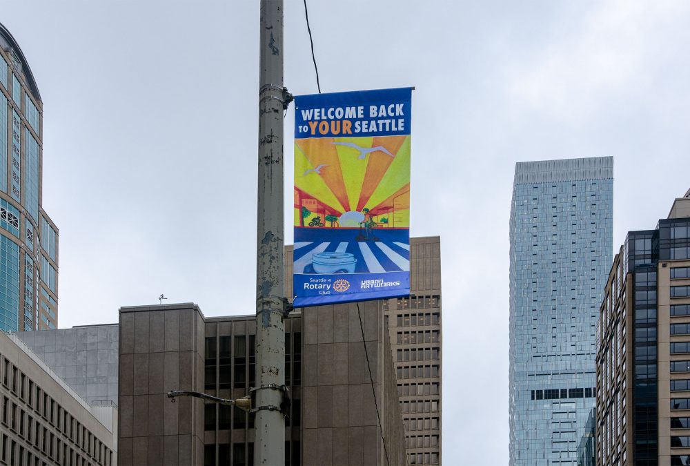 Seattle #4 Rotary, Urban Artworks and SuperGraphics partner to beautify downtown with 44 artistic banners following the shutdown. Young artists were curated by Urban Artworks for this