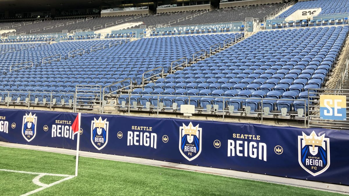 Seattle Reign field banners, produced and installed by SuperGraphics. Showcases Seattle Reign iconography and logos in front of stadium seats.