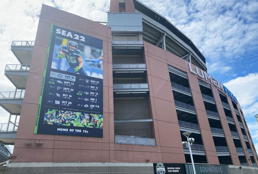 Seattle Seahawks 2022 schedule banner, completed by SuperGraphics. SuperFormat™ sized building banner on the outside of Lumen Field. Printed on EcoFormat™ PVC-free recyclable material.