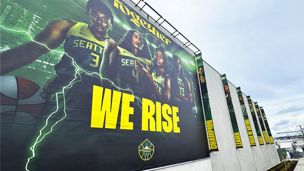 Seattle Storm Training Facility building banners, produced and installed by SuperGraphics. Features photos of various players and brand messaging.