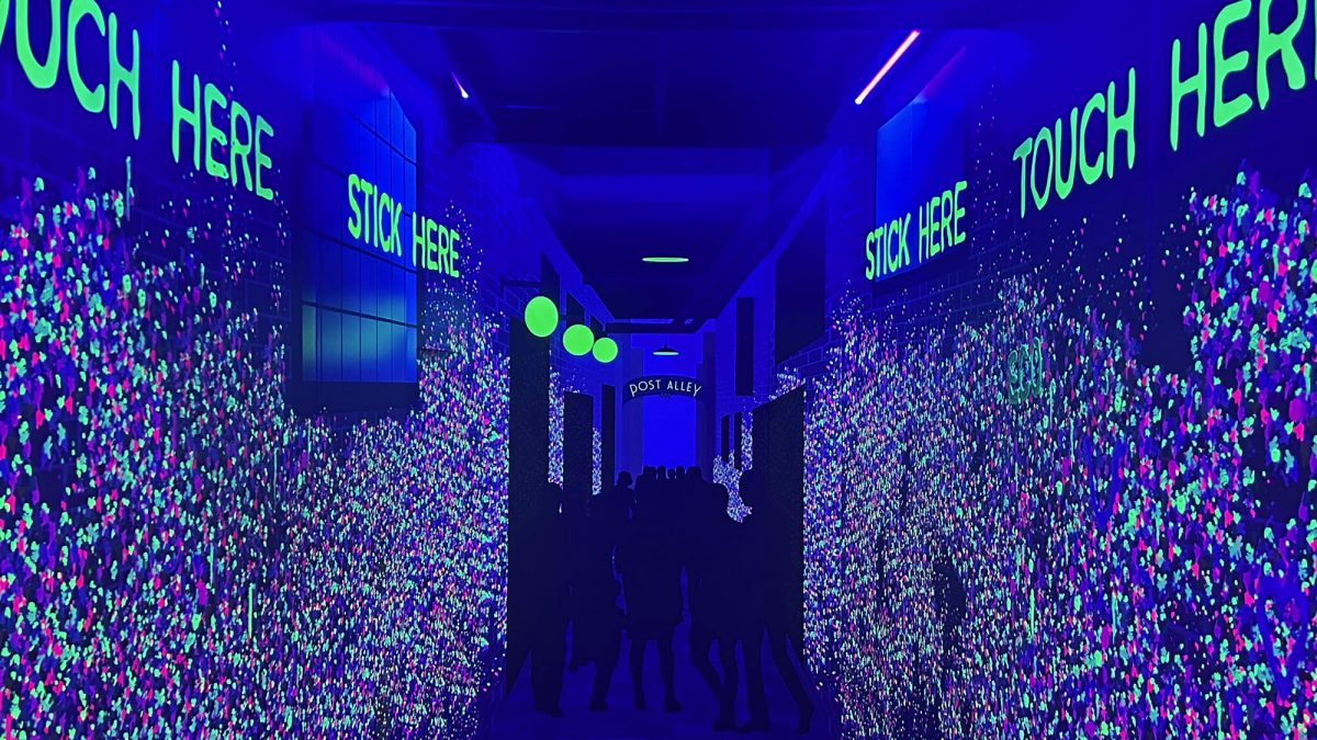 Gum Wall from SuperGraphics' Sustainability Summit event, completed by SuperGraphics. Shows neon inks radiating under black light in replication of Gum Wall from EcoFormat Display boards.