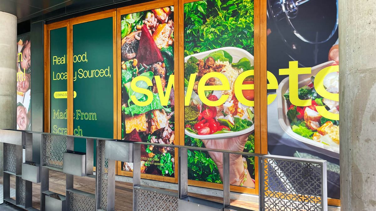 Window graphics for SweetGreen restaurant with 'coming soon' branding completed by SuperGraphics