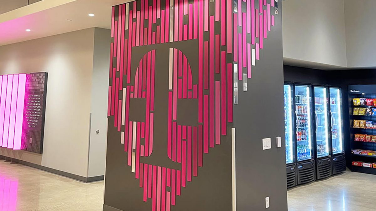 T-Mobile Call Center graphics in Kingsburg, CA, completed by SuperGraphics. Showcases laser-cut Acrylic graphic installation.