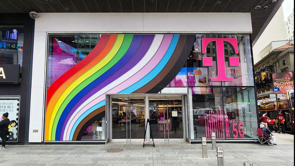 T-Mobile Pride Window Graphics, produced and installed by SuperGraphics. Showcases rainbows cascading across storefront windows.