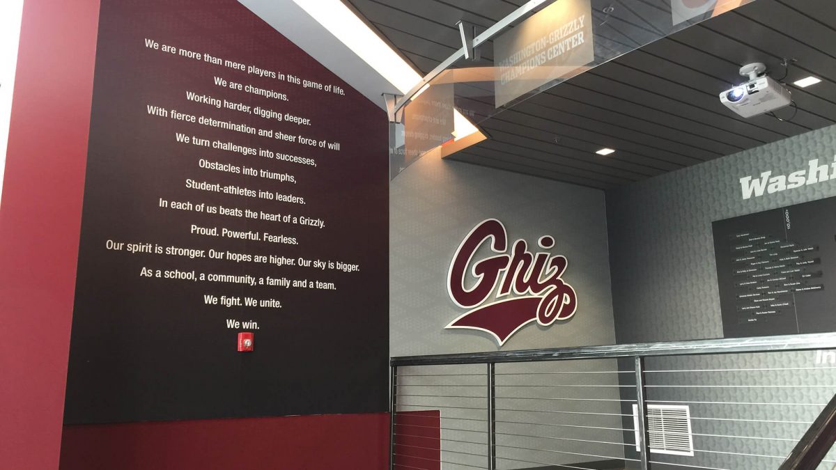 University of Montana Athletics Facility branding, produced and installed by SuperGraphics. Showcases mission statement wall graphics and logo dimensional signage.