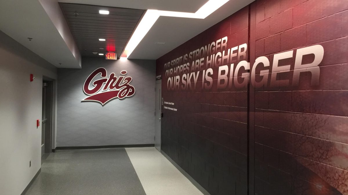 University of Montana Athletics Facility branding, produced and installed by SuperGraphics. Showcases Griz logo behind red and silver branded graphics.