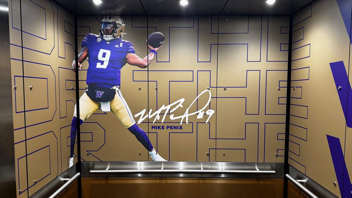 University of Washington elevator wall mural, produced and installed by SuperGraphics. Showcases photography of player along with branded graphics.
