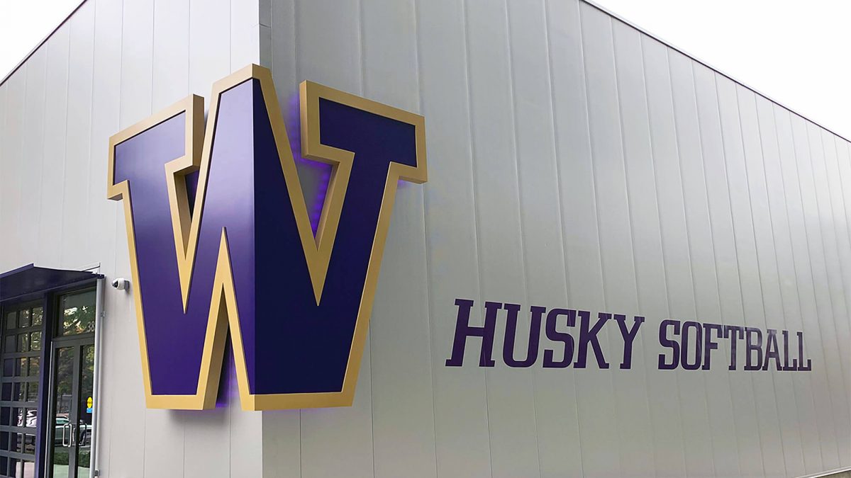 University of Washington Softball performance center signage, produced and installed by SuperGraphics. Showcases facility name and dimensional logo signage.
