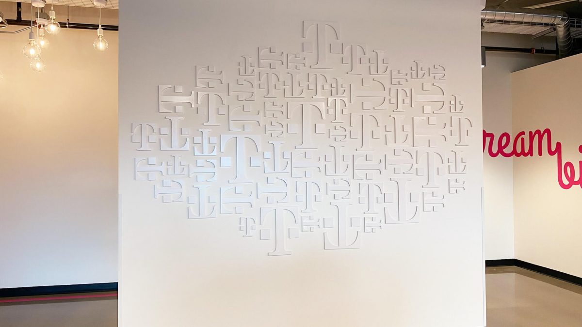 T-Mobile printed digit display, completed by SuperGraphics. Showcases white T digits produced and arranged on wall.