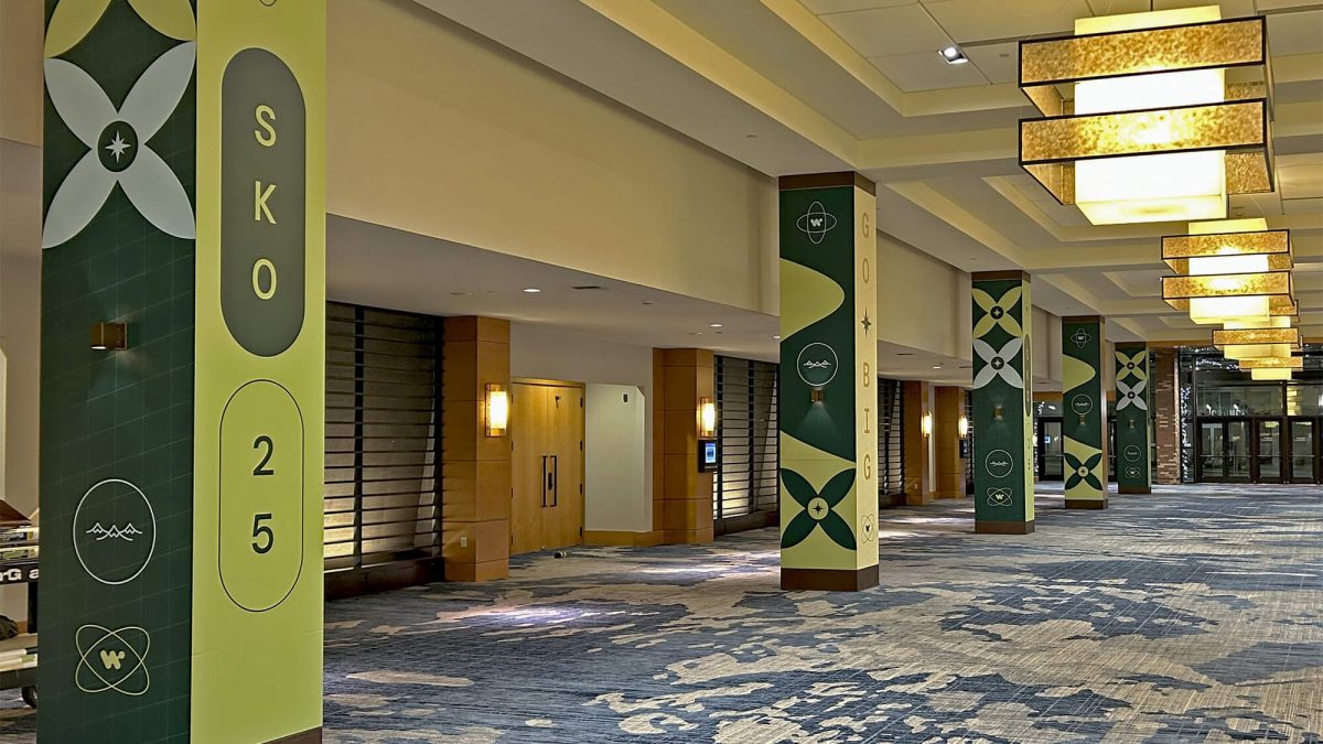 Column wraps from Workato Convention, produced and installed by SuperGraphics. Showcases Workatoo event branding on convention center's columns.